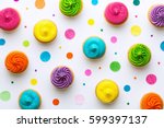 Colorful Cupcakes On A White...