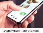 Small photo of Online shopping and fashion store website with add to cart button in mobile phone. Customer order and purchase product on internet site. Ecommerce and retail business concept. Digital transaction.