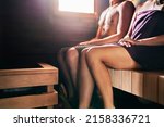 Sauna and couple spa wellness treatment. Steam room bath therapy for woman and man. Two young people enjoying romantic retreat together. Traditional Finnish relaxation in summer. Luxury health care.