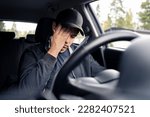 Small photo of Tired man in car. Sleepy drowsy driver, fatigue. Driving and sleeping in vehicle. Exhausted, bored or drunk person. Serious upset man with stress, despair, anxiety or melancholy. Problem in traffic.