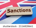 Sanctions are shown by the text with Britain flag and russian flag under it.