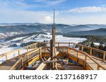 Beskid mountain winter landscape seen from the wooden path of the treetop observation tower at Slotwiny Arena ski station in Krynica Zdroj, Poland