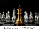 Small photo of Golden King chess standing in front of other chess, Concept of a leader must have courage and challenge in the competition, leadership and business vision for a win in business games