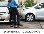 Small photo of Two Drivers using a smartphone to exchange phone numbers and social media after a car accident. Concept of claim insurance for a car accident online after send photo and evidence to insurance company