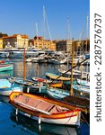 Small photo of Nice, France - August 5, 2022: Nice port with yachts, boats and pierces in Nice Port and yacht marina district with Colline du Chateau Castle hill on French Riviera