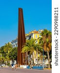 Small photo of Nice, France - August 5, 2022: Neuf Lignes Obliques Nine Oblique Lines monument by Bernar Venet at Promenade des Anglais along Nice beach on French Riviera Azure Coast