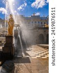 Small photo of St. Petersburg, Russia - August 23, 2023: Fountains of Peterhof. Golden statues of Grand Cascade and Samson Fountain at Peterhof Palace. View from upper grottoes