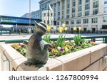 Small photo of Milwaukee, Wisconsin - May 26th, 2018: The Gertie the Duck bronze statue and her six ducklings near the Wisconsin Avenue bridge created by Gwendolyn Gillen intriguing visitors as they pass by.