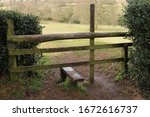 Wooden Stile Leading To A Field....
