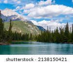 Small photo of Town of Banff, Bow River Trail scenery in summer sunny day. Banff National Park, Canadian Rockies, Alberta, Canada. Mount Rundle in the background.