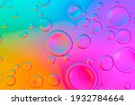 Small photo of Vivid neon background with bubbles. Colorful abstract backdrop with bright gradients on blobs. Multicolor overflowing picture.