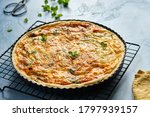 Quiche with ham and cheese. Open pie.