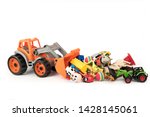 Toy Excavator Raking A Lot Of...