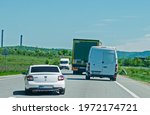 Small photo of Dangerous maneuvers in traffic. A car overtakes and from the opposite direction comes another car. Romania, Cocorova. May, 08, 2021