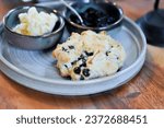 Small photo of scone , blueberry scone or scone with whipped cream and blueberry dressing and butter
