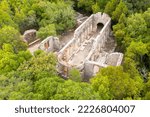 Small photo of The Great Basilica. Ruins. Butrint National Park and Museum-Reserve. The basilica is made of stone, with a nave and two rows of arches. View from above. Drone shooting. Saranda. Butrint. Albania