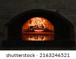Small photo of Firewood burning in the oven. Wood-fired oven
