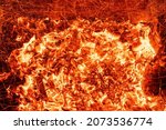 Small photo of Top above overhead detail view od abstract hot red burning wooden coal background in bbq grill brazier or firepit at dark night time. Beautiful inferno heat sparks glowing flaming at hearth stove