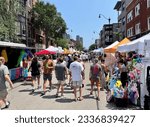 Small photo of CHICAGO - JULY 23, 2023: People Stroll and Browse Local Vendors at Lincoln Park Fest Street Fair on July 23, 2023 in Chicago. The city hosts a number of summer street fairs each year.