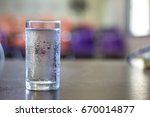 Glass Of Cold Water On Desk In...