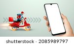 Small photo of Smartphone in hand and fast delivery man on a red scooter. Delivery concept, online order, food delivery, last mile, banner, template