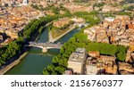 Small photo of Aerial view of Tiber Island, the only river island in the part of the Tiber which runs through Rome, Italy. In the period of ancient Rome, the temple of Asclepius stood here