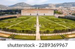 Aerial view of the Royal Palace of Caserta also known as Reggia di Caserta. It is a former royal residence with large gardens in Caserta, near Naples, Italy. It is the main facade of the building.