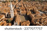 Small photo of Aerial view of the Modena Cathedral and Torre della Ghirlandina, a bell tower. It is is a Roman Catholic church dedicated to the Assumption of the Virgin Mary and Saint Geminianus located in Italy.