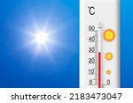 Celsius scale thermometer shows plus 30 degrees . Yellow sun in blue sky. Summer heat