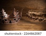 Crown Of Thorns with Crown Of on wooden background. The death and victory of Jesus Christ.