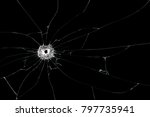 Broken glass background with bullet hole. Isolated on black background.