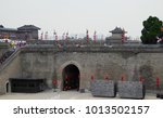Small photo of Xian,Shanxi,China.August 17,2015.Tower on the Xian Circumvallation with many tourists walking and traveling in shanxi province China.