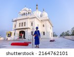 Small photo of Anandpur Sahib, Punjab, India - March 2022: Gurdwara Takht Sri Kesgarh Sahib in anandpur sahib, the birthplace of the khalsa sacred to the sikh religion. Old sikh guard protecting the building