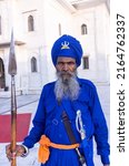 Small photo of Anandpur Sahib, Punjab, India - March 2022: Gurdwara Takht Sri Kesgarh Sahib in anandpur sahib, the birthplace of the khalsa sacred to the sikh religion. Old Sikh guard protecting the building