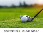 Small photo of Golf balls on the golf course with golf clubs ready for golf in the first short. In the morning, with the beautiful sunlight.