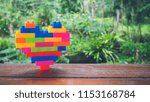 Small photo of Rainbow heart block toy.