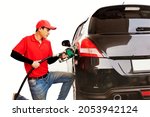 Small photo of Male worker in a red uniform is delighted to provide the customer with the utmost care to refuel the gasoline for the customer's vehicle on a white background.