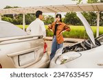 Small photo of Angry woman quarrels with man who drives car in front of him suddenly causing an accident on the road that drives private car illegally causing damage, requiring insurance liability : Car insurance