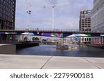 Small photo of London, UK - July 17 2016: bridge of the DLR (Docklands Light Railway) crossing Middle Dock in Canary Wharf, Tower Hamlets