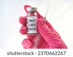 Small photo of Pink generic vaccine or booster in vial with blank label for mock up copy space - women's health breast cancer vaccine concept