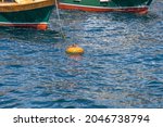 Red Buoy And Boats On The Sea
