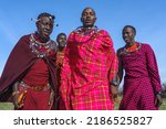 Small photo of Maasai Mara man in traditional colorful clothing at Maasai Mara tribe village famous Safari travel destination near Maasai Mara National Reserve Kenya