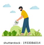 young man watering plants in... | Shutterstock .eps vector #1933086014