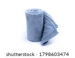 Comfort Rolled up grey coral fleece throw isolated on white background