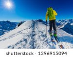 Skitouring with amazing view of swiss famous mountains in beautiful winter powder snow of Alps. 