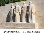 Small photo of The four statues at the center of the Reformation Wall in the Parc des Bastions in Geneva, Switzerland, representing John Calvin and the Calvinism's main proponents, on a sunny summer day.