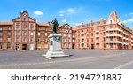 Small photo of Guise, France - August 5, 2022: Statue to Godin in front of the Social Palace of the Familistere, a phalanstery-type building complex he built in the 1860s for housing the employees of his foundry.