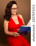Small photo of Coaching woman, concentrated reading motivational book. Nonviolent communication concept. Isolated on brown background.