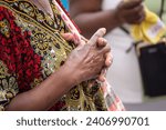 Small photo of Hands of a religious person in prayer and peace. Concept of religiosity.