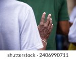 Small photo of Hands of a religious person in prayer and peace. Concept of religiosity.